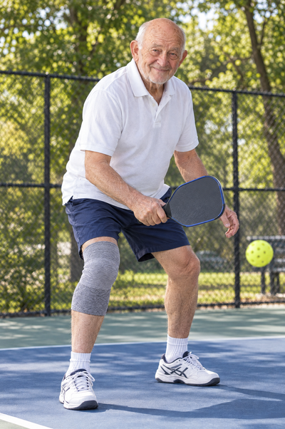 Playing pickleball with a bamboo knee sleeve